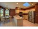Bright eat-in kitchen featuring a bay window, central island and stainless steel appliances at 8926 Sw 192Nd Court Rd, Dunnellon, FL 34432