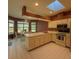 Bright eat-in kitchen featuring a bay window, central island and modern appliances at 8926 Sw 192Nd Court Rd, Dunnellon, FL 34432