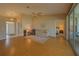 Bright living room with hardwood floors, neutral walls, and sliding glass doors to a patio at 8926 Sw 192Nd Court Rd, Dunnellon, FL 34432