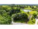 Aerial view of an estate with a pond and lush, green pastures surrounding the home at 8940 Sw 8Th St, Ocala, FL 34481