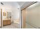 Bathroom with a vanity, a soaking tub, and a glass enclosed shower at 8940 Sw 8Th St, Ocala, FL 34481