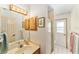 Bathroom with a vanity, mirror, light fixture and a walk-in shower at 8940 Sw 8Th St, Ocala, FL 34481