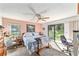 Spacious bedroom with natural light and view of the community provides a serene retreat within the home at 8940 Sw 8Th St, Ocala, FL 34481