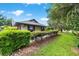 Charming single-story home featuring a well-manicured lawn with lush, green landscaping and updated exterior paint at 8940 Sw 8Th St, Ocala, FL 34481