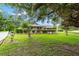 Charming home with a well-manicured lawn and mature trees at 8940 Sw 8Th St, Ocala, FL 34481