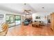 Bright living room with a fireplace, tile floors and access to the pool area at 8940 Sw 8Th St, Ocala, FL 34481