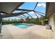 Sparkling screened-in pool for swimming and relaxing with ample patio space, perfect for outdoor living at 8940 Sw 8Th St, Ocala, FL 34481