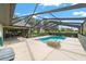 View of the swimming pool and screened-in lanai, an ideal setting for relaxing and entertaining outdoors at 8940 Sw 8Th St, Ocala, FL 34481
