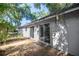 Backyard with multiple sliding glass doors at 9 Juniper Pass Trl, Ocala, FL 34480