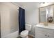 Functional bathroom featuring a shower-tub combo and vanity with updated hardware at 9 Juniper Pass Trl, Ocala, FL 34480