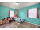 Bright bedroom with colorful walls, furnishings, and natural light at 9 Juniper Pass Trl, Ocala, FL 34480
