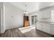 Bright dining room adjacent to the kitchen with a sliding glass door at 9 Juniper Pass Trl, Ocala, FL 34480