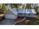 Aerial view of a charming single-story house with garage at 9 Juniper Pass Trl, Ocala, FL 34480