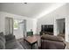 Cozy living room with a large window and neutral-toned walls at 9 Juniper Pass Trl, Ocala, FL 34480