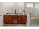 Beautiful bathroom featuring a double vanity, granite countertops, and glass-enclosed shower at 9309 Sw 106Th Ave, Ocala, FL 34481