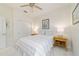 Bright bedroom with neutral decor, a ceiling fan, and a sliding-door closet for ample storage space at 9309 Sw 106Th Ave, Ocala, FL 34481