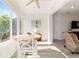 Sun-drenched breakfast nook boasts a cozy round table and views of the backyard at 9309 Sw 106Th Ave, Ocala, FL 34481