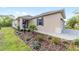 Inviting home featuring a landscaped yard and cozy porch at 9309 Sw 106Th Ave, Ocala, FL 34481