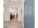 Bright foyer with wood floors, with an open view into a home office with a desk and bookshelves at 9309 Sw 106Th Ave, Ocala, FL 34481