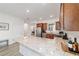 Well-appointed kitchen with granite countertops, stainless steel appliances, and an island, perfect for cooking and dining at 9309 Sw 106Th Ave, Ocala, FL 34481