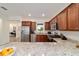 Spacious kitchen featuring granite countertops, stainless steel appliances, and ample cabinet space for storage at 9309 Sw 106Th Ave, Ocala, FL 34481
