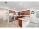 Contemporary kitchen boasts stainless steel appliances, granite countertops, and a breakfast bar with seating at 9309 Sw 106Th Ave, Ocala, FL 34481