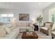 Bright living room featuring a neutral color scheme and comfortable furnishings at 9309 Sw 106Th Ave, Ocala, FL 34481