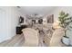 Spacious living room with comfortable seating, modern entertainment setup, and open flow to the kitchen at 9309 Sw 106Th Ave, Ocala, FL 34481