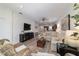 Well-lit living space with an open floor plan, flowing into the kitchen at 9309 Sw 106Th Ave, Ocala, FL 34481