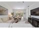 Cozy living area with stylish decor, ceiling fan, and sliding doors to outdoor space at 9309 Sw 106Th Ave, Ocala, FL 34481