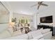 Comfortable seating area with wicker chairs, sectional sofa, and a media cabinet at 9309 Sw 106Th Ave, Ocala, FL 34481