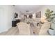 Open-plan living area with a stylish entertainment center and a plant at 9309 Sw 106Th Ave, Ocala, FL 34481