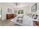 Serene main bedroom featuring neutral tones, stylish furniture, and natural light at 9309 Sw 106Th Ave, Ocala, FL 34481