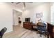 Bright office with wood floors, a ceiling fan, and a comfortable workspace for remote work and productivity at 9309 Sw 106Th Ave, Ocala, FL 34481