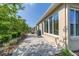 A backyard featuring a patio, a grill, and lush greenery, creating a private outdoor space at 9309 Sw 106Th Ave, Ocala, FL 34481