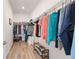 Spacious walk-in closet with two rods for hanging clothes and shoe shelves at 9309 Sw 106Th Ave, Ocala, FL 34481