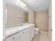 Modern bathroom featuring a marble countertop vanity and tile shower at 10121 Sw 130Th Ter, Dunnellon, FL 34432