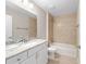 Bathroom with granite-topped vanity, tiled shower, and soaking tub for a spa-like experience at 10121 Sw 130Th Ter, Dunnellon, FL 34432