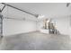 Spacious garage with concrete floors and overhead lighting, offering ample parking and storage at 10121 Sw 130Th Ter, Dunnellon, FL 34432