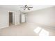 Spacious bedroom with neutral walls, carpet flooring, and a ceiling fan at 10121 Sw 130Th Ter, Dunnellon, FL 34432