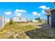 Large backyard with a storage shed, privacy fence, and landscaping, perfect for outdoor enjoyment at 10291 Se 67Th Ter, Belleview, FL 34420
