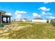 Expansive backyard featuring a shed and privacy fence, perfect for outdoor activities and relaxation at 10291 Se 67Th Ter, Belleview, FL 34420