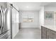 Bright kitchen area featuring modern cabinets, stainless steel appliances, and adjacent dining nook at 10291 Se 67Th Ter, Belleview, FL 34420