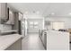 Modern kitchen with stainless steel appliances, gray cabinets, and a spacious center island at 10291 Se 67Th Ter, Belleview, FL 34420