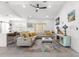 Open-concept living room boasts contemporary decor, a stylish rug, and flows seamlessly into the kitchen area at 10291 Se 67Th Ter, Belleview, FL 34420