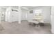 Spacious open-concept living space features a modern barn door and light gray tile flooring at 10291 Se 67Th Ter, Belleview, FL 34420