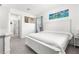 Spacious main bedroom featuring neutral color palette and tile flooring, promoting relaxation at 10291 Se 67Th Ter, Belleview, FL 34420