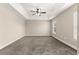 Bedroom featuring plush carpet, tray ceiling, ceiling fan, and natural light at 10313 Sw 45Th Ave, Ocala, FL 34476