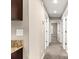 Hallway view with neutral walls, carpeted floor, and white doors at 10313 Sw 45Th Ave, Ocala, FL 34476