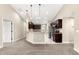 Open concept kitchen area with granite countertops, tiled flooring, and dark wood cabinetry at 10313 Sw 45Th Ave, Ocala, FL 34476